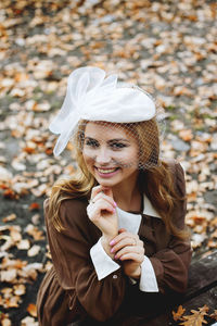 Portrait of young woman wearing hat