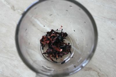 High angle view of red tea in glass