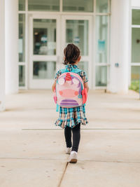 Diverse mixed race pre school age girl heading back to school after summer break