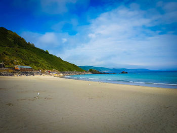 Scenic view of sea against cloudy sky