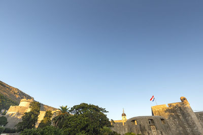 Low angle view of buildings against clear sky
