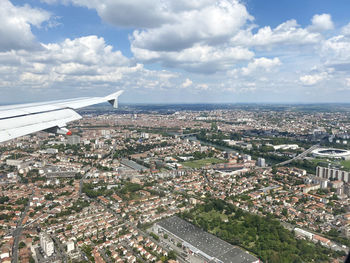 Aerial view of city against sky