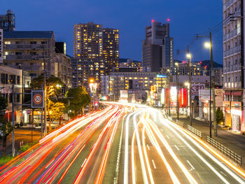 High angle view of light trails on road at night