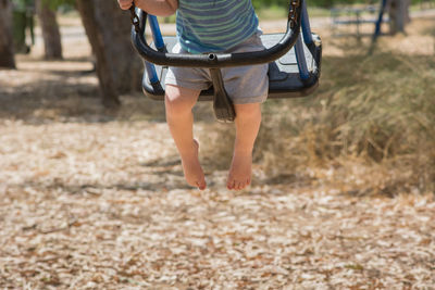 Low section of man walking on land