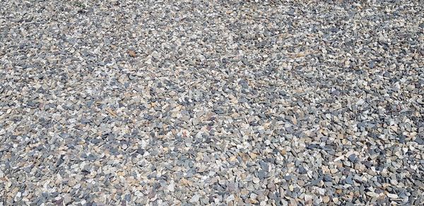 High angle view of stones on pebbles