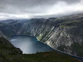 Scenic view of lake and mountains against sky