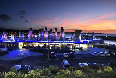 Illuminated building against sky at night