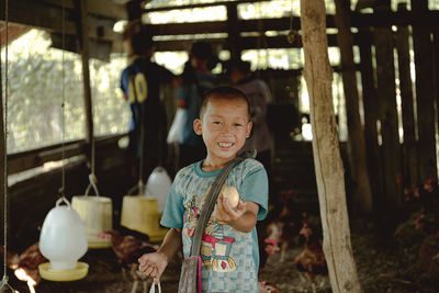 Portrait of boy standing outdoors