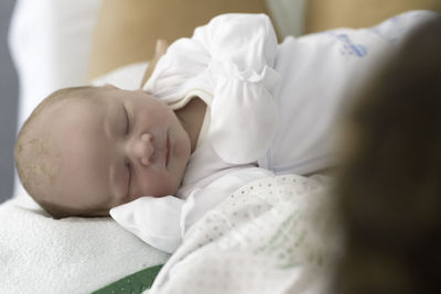 Cute baby sleeping on bed