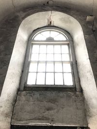 Low angle view of window in old building