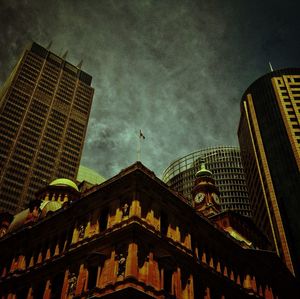 Low angle view of building against cloudy sky