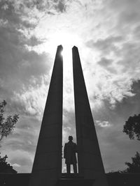 Low angle view of woman against sky