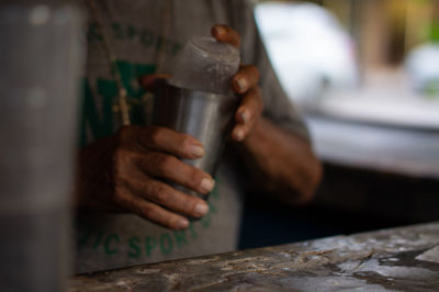 Close-up of hand holding coffee cup