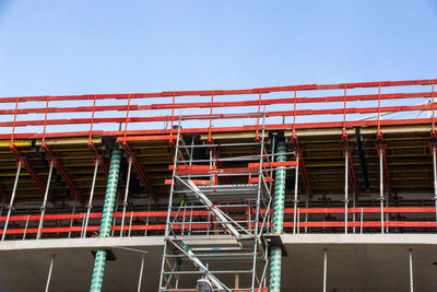 Low angle view of construction site against clear sky