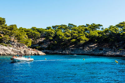 Scenic view of sea against clear blue sky