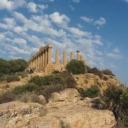 Low angle view of old ruins against sky