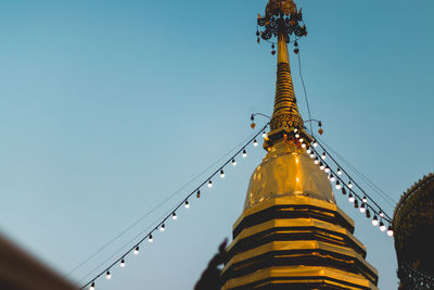 Low angle view of traditional building against clear blue sky