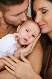 Close-up of mother and daughter at home
