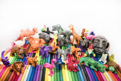 Close-up of various toys against white background