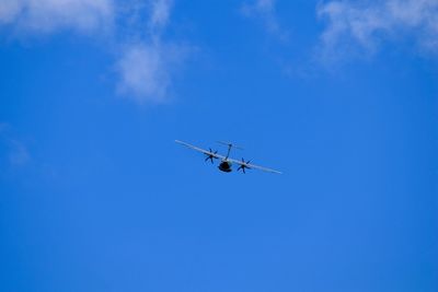 Low angle view of airplane flying in sky