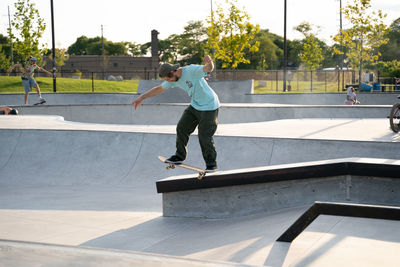 Full length of man skateboarding on skateboard