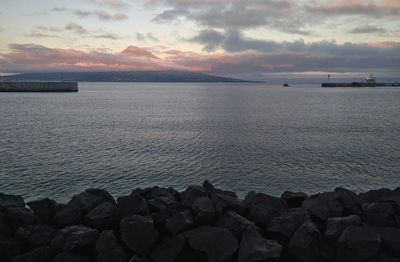 Scenic view of sea against cloudy sky