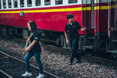 Full length of man standing on railroad track