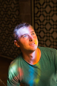 Portrait of young man looking away