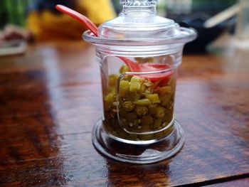 Close-up of drink in glass jar on table