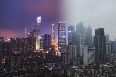 Illuminated buildings in city against sky