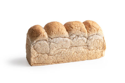 Close-up of bread against white background