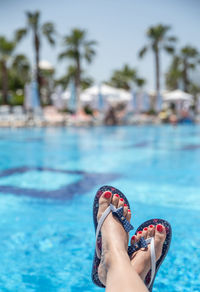 Low section of woman in swimming pool