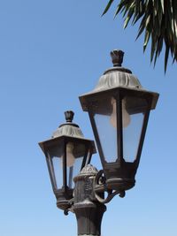 Low angle view of statue against clear blue sky