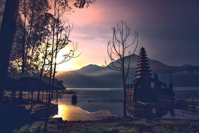 Scenic view of lake against sky during sunset