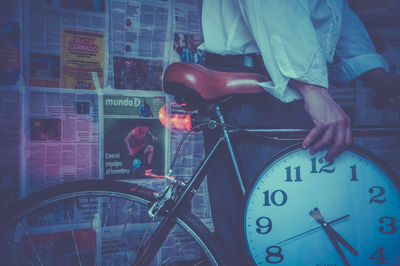 Midsection of man with bicycle