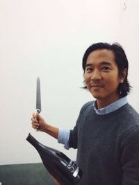 Portrait of man holding smart phone