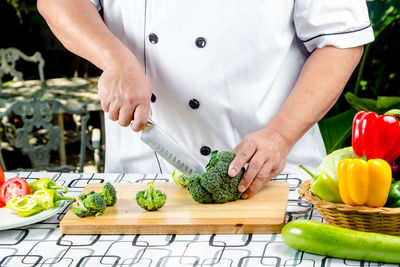 Midsection of man preparing food