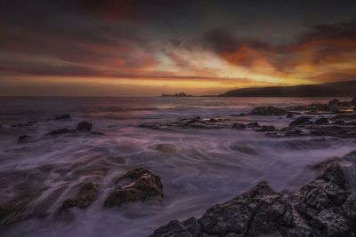 Scenic view of sea against sky during sunset