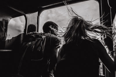 Man and woman traveling in train