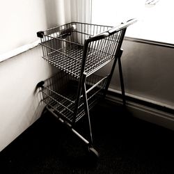 Close-up of trolley in corner by window