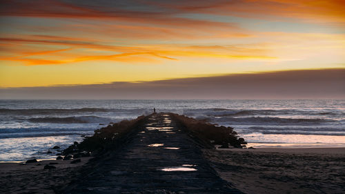 Scenic view of sea against sky during sunset