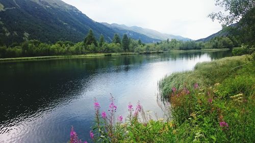 Scenic view of lake with mountains in background