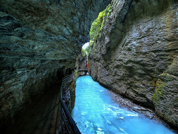 High angle view of water flowing through rocks