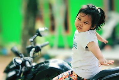 Little girl on a motorbike.