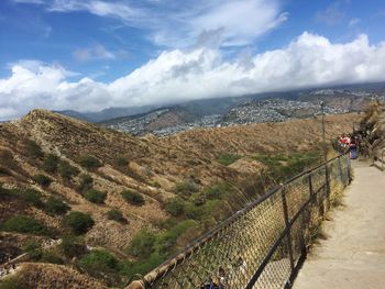 Scenic view of landscape against cloudy sky