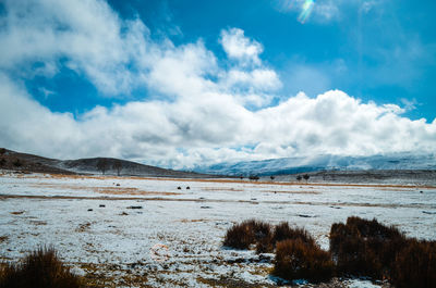 Scenic view of snowcapped mountains against sky