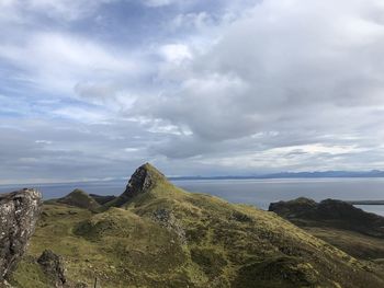 Scenic view of rocks on land against sky