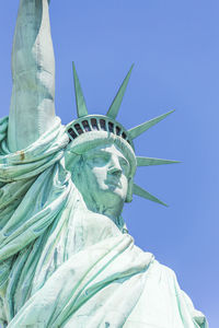 Low angle view of statue against sky