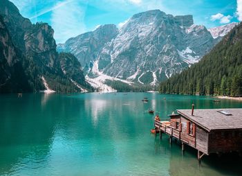 Scenic view of lake and mountains against sky