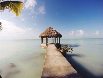 Gazebo amidst sea against sky